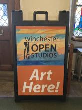 Sandwich board holder with poster